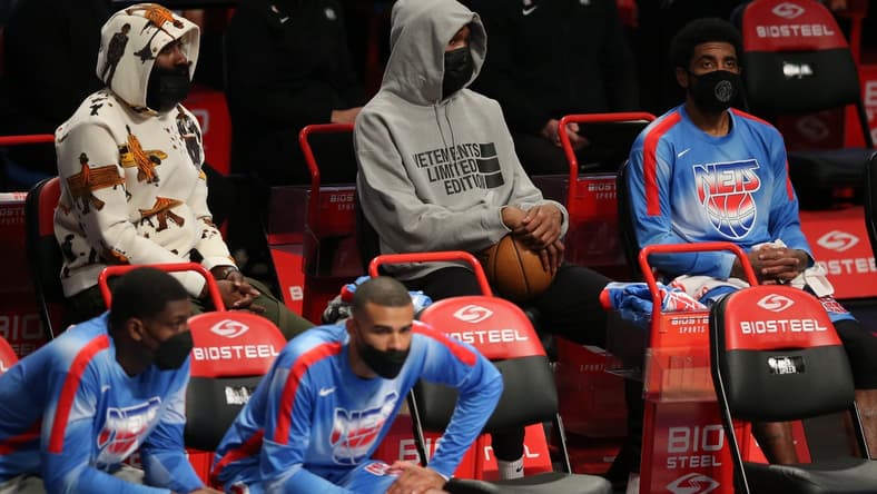 Apr 30, 2021; Brooklyn, New York, USA; Brooklyn Nets shooting guard James Harden (left to right) and power forward Kevin Durant (7) and point guard Kyrie Irving (11) sit on the bench during the third quarter against the Portland Trailblazers at Barclays Center. Harden and Durant didn't play in the game. Mandatory Credit: Brad Penner-USA TODAY Sports