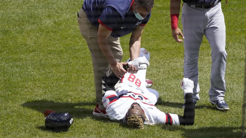 May 2, 2021; Chicago, Illinois, USA; Chicago White Sox center fielder Luis Robert (88) is hurt after beating out an infield single against the Cleveland Indians during the first inning at Guaranteed Rate Field. Mandatory Credit: David Banks-USA TODAY Sports