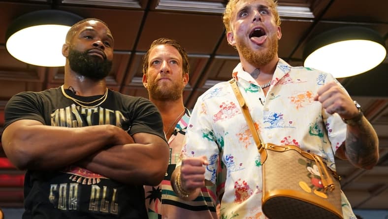 Jun 3, 2021; Miami Beach, Florida, USA; Professional MMA fighter Tyron Woodley and YouTube star Jake Paul face off in front of Bar Stool Sports founder Dave Portnoy at World Famous 5th St. Gym. Mandatory Credit: Jasen Vinlove-USA TODAY Sports