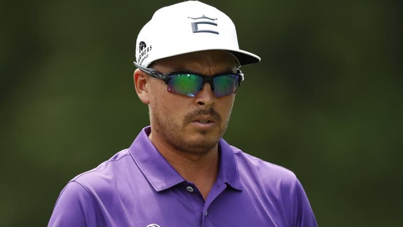 Jul 3, 2021; Detroit, Michigan, USA; Rickie Fowler walks off the 18th tee box during the third round of the Rocket Mortgage Classic golf tournament. Mandatory Credit: Raj Mehta-USA TODAY Sports