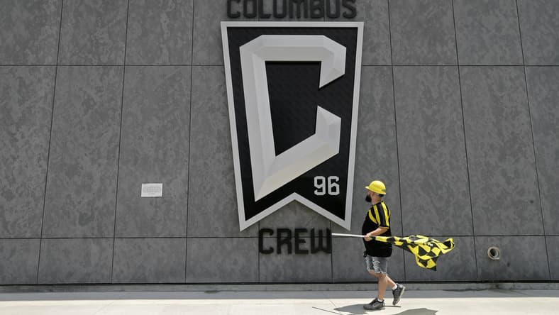 Nick Auddino, of Westerville, walks in front of a Columbus Crew logo on the west side of Lower.com Field before attending the inaugural match between the Columbus Crew and the New England Revolution in Columbus on Saturday, June 1, 2021. Auddino is a longtime Crew supporter who has only missed one game for the birth of his son. His children Jordan, 12, and Laina, 6, Auddino, were attending the match with him.
01 fans