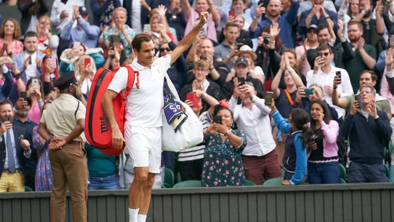 Jul 7, 2021; London, United Kingdom; Roger Federer (SUI) waving farewell to the Centre Court fans after losing to Hubert Hurkacz (POL) in the quarter finals at All England Lawn Tennis and Croquet Club. Mandatory Credit: Peter van den Berg-USA TODAY Sports