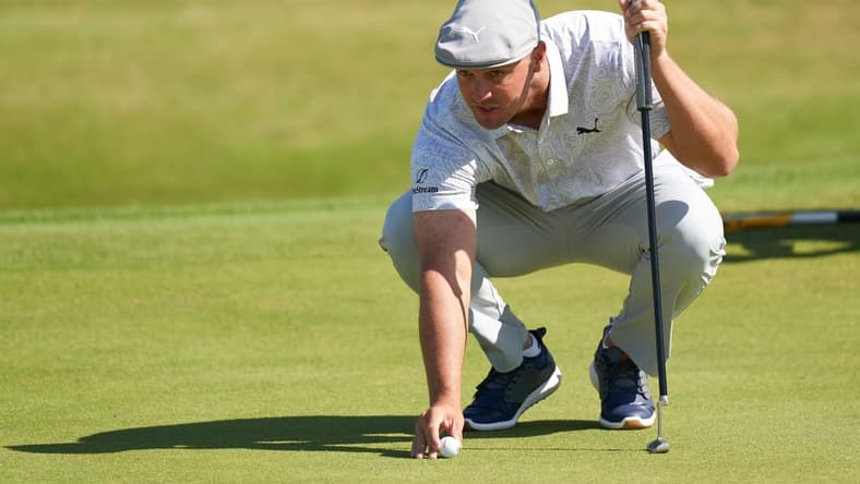 Jul 16, 2021; Sandwich, England, GB; Bryson DeChambeau lines up a putt on the sixth green during the second round of the Open Championship golf tournament. Mandatory Credit: Peter van den Berg-USA TODAY Sports