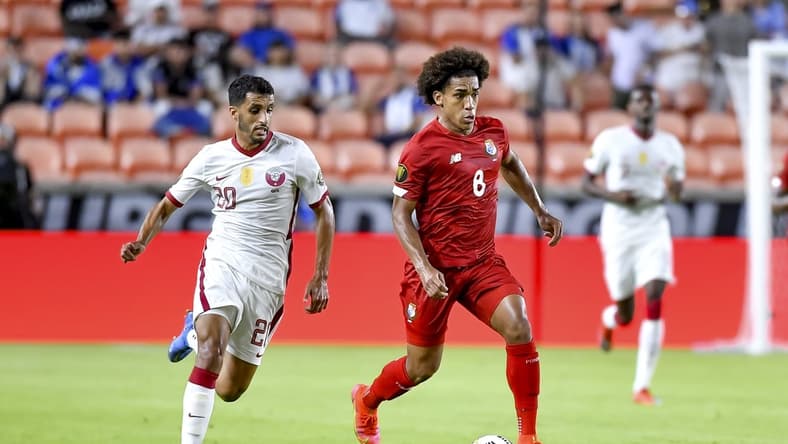 Jul 13, 2021; Houston, Texas, USA; Panama midfielder Adalberto Carrasquilla (8) dribbles the ball as /Qatar midfielder Abdullah Al Ahrak (20) defends during the second half CONCACAF Gold Cup Soccer group stage play at BBVA Stadium. Mandatory Credit: Maria Lysaker-USA TODAY Sports