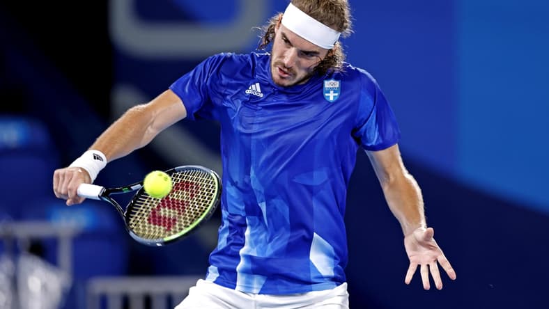 Jul 27, 2021; Tokyo, Japan; Stefanos Tsitsipas (GRE) plays Frances Tiafoe (USA) in the mens tennis first round singles during the Tokyo 2020 Olympic Summer Games at Ariake Tennis Park. Mandatory Credit: Yukihito Taguchi-USA TODAY Sports