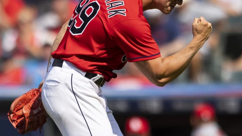 Jul 28, 2021; Cleveland, Ohio, USA; Cleveland Indians pitcher James Karinchak (99) pump his fist following the final out against the Cleveland Indians at Progressive Field. Mandatory Credit: Scott Galvin-USA TODAY Sports
