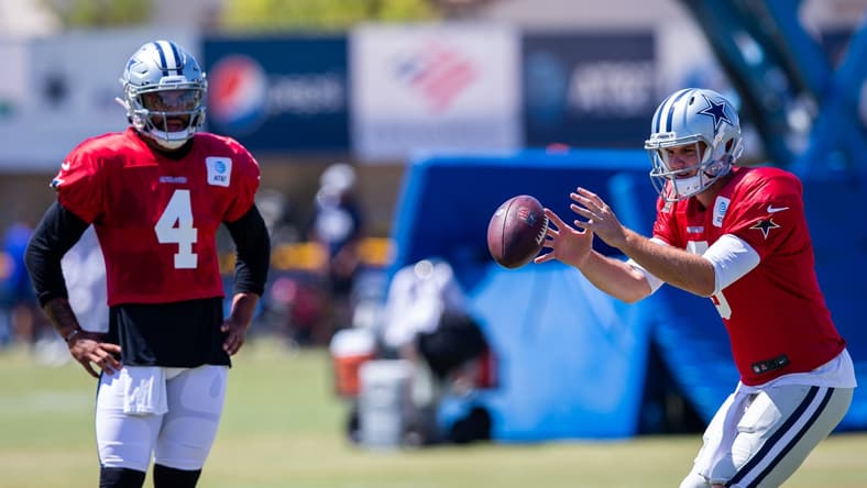 Jul 29, 2021; Oxnard, CA, USA; Dallas Cowboys quarterbacks Dak Prescott (4) and quarterback Garrett Gilbert (3) during training camp at the River Ridge playing fields at the Residence Inn by Marriott in Oxnard, California. Mandatory Credit: Jason Parkhurst-USA TODAY Sports