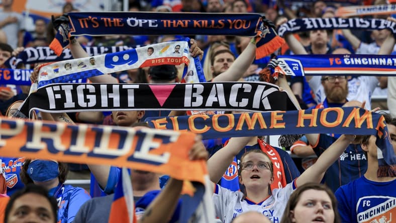 Jul 31, 2021; Cincinnati, OH, USA; Fans hold their scarfs in The Bailey during the national anthem prior to the game between D.C. United and FC Cincinnati in the first half at TQL Stadium. Mandatory Credit: Aaron Doster-USA TODAY Sports