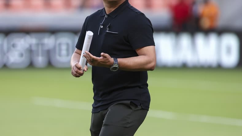 Jul 31, 2021; Houston, Texas, USA; Real Salt Lake head coach Freddy Juarez walks onto the field before a match against the Houston Dynamo FC at BBVA Stadium. Mandatory Credit: Troy Taormina-USA TODAY Sports