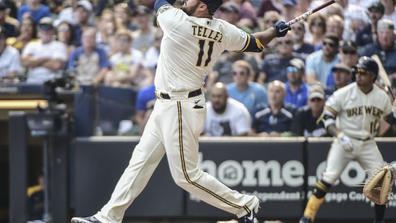Aug 4, 2021; Milwaukee, Wisconsin, USA; Milwaukee Brewers first baseman Rowdy Tellez (11) hits a three-run home run in the seventh inning against the Pittsburgh Pirates at American Family Field. Mandatory Credit: Benny Sieu-USA TODAY Sports
