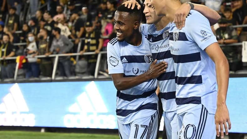 Aug 4, 2021; Los Angeles, CA, Los Angeles, CA, USA; Sporting Kansas City midfielder Gadi Kinda (17) and forward Daniel Salloi (20) celebrate after a goal by forward Alan Pulido (9) in the first half against Los Angeles FC at Banc of California Stadium. Mandatory Credit: Jayne Kamin-Oncea-USA TODAY Sports