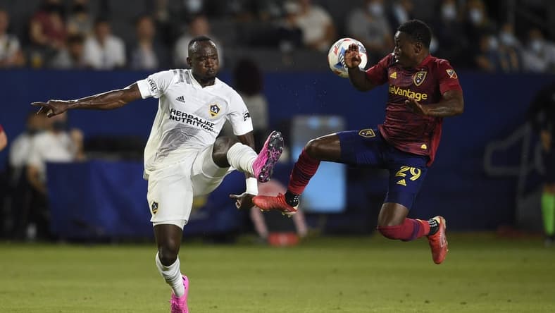 Aug 4, 2021; Carson, California, USA; LA Galaxy defender S ga Coulibaly (4) and Real Salt Lake forward Anderson Julio (29) battle for the ball during the first half at StubHub Center. Mandatory Credit: Kelvin Kuo-USA TODAY Sports