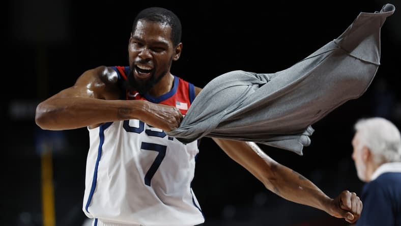 Aug 5, 2021; Saitama, Japan; United States forward Kevin Durant (7) celebrates on the bench against Australia in the third quarter during the Tokyo 2020 Olympic Summer Games at Saitama Super Arena. Mandatory Credit: Geoff Burke-USA TODAY Sports
