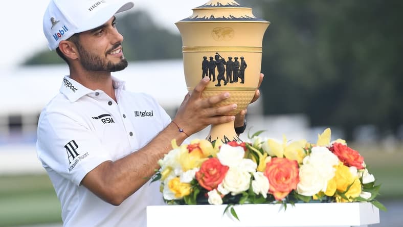 Aug 8, 2021; Memphis, Tennessee, USA, Abraham Ancer poses with the Gary Player Cup after winning WGC FedEx St. Jude Invitational golf tournament at TPC Southwind in a two hole playoff. Mandatory Credit: Christopher Hanewinckel-USA TODAY Sports
