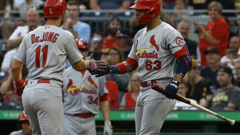 Aug 10, 2021; Pittsburgh, Pennsylvania, USA;  St. Louis Cardinals shortstop Paul DeJong (11) celebrates with second baseman Edmundo Sosa (63) after hitting a a solo home run against the Pittsburgh Pirates during the second inning at PNC Park. Mandatory Credit: Charles LeClaire-USA TODAY Sports