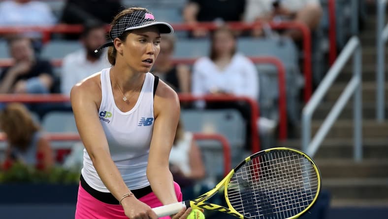 Aug 11, 2021; Montreal, Quebec, Canada; Danielle Collins from USA serves against Simona Halep from Romania (not pictured) during the second round play at Stade IGA. Mandatory Credit: Jean-Yves Ahern-USA TODAY Sports