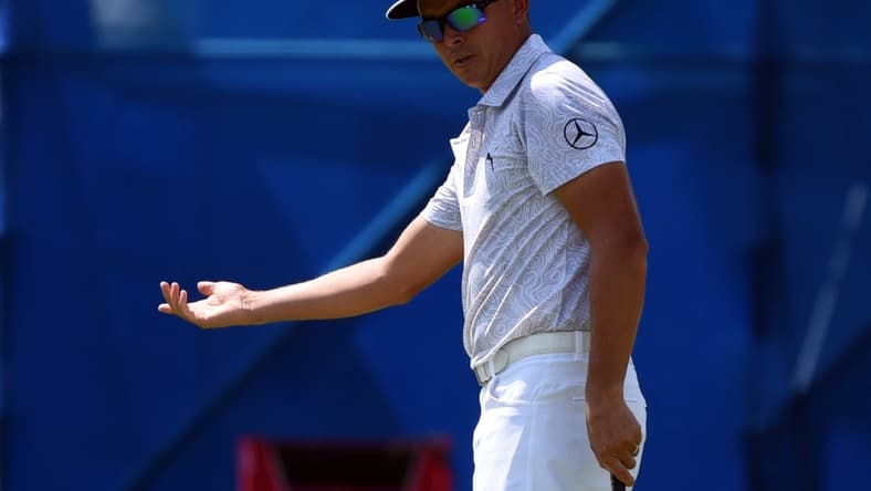 Aug 12, 2021; Greensboro, North Carolina, USA; Rickie Fowler reacts to a missed putt on the ninth hole during the first round of the Wyndham Championship golf tournament. Mandatory Credit: Rob Kinnan-USA TODAY Sports