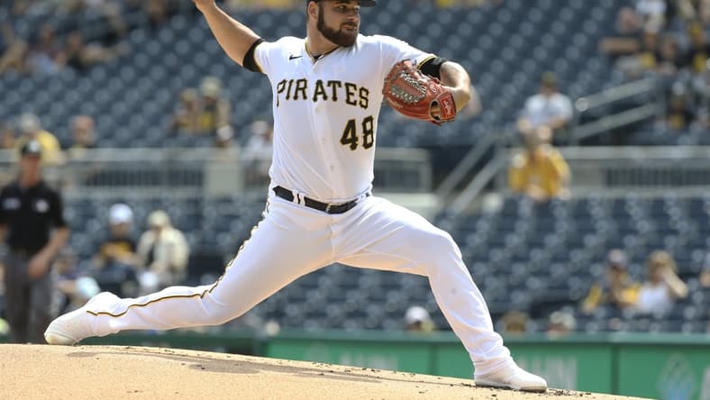 Aug 14, 2021; Pittsburgh, Pennsylvania, USA; Pittsburgh Pirates starting pitcher Bryse Wilson (48) delivers a pitch against the Milwaukee Brewers during the first inning at PNC Park. Mandatory Credit: Charles LeClaire-USA TODAY Sports