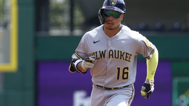 Aug 14, 2021; Pittsburgh, Pennsylvania, USA;  Milwaukee Brewers second baseman Kolten Wong (16) circles the bases on a lead off solo home run against the Pittsburgh Pirates during the first inning at PNC Park. Mandatory Credit: Charles LeClaire-USA TODAY Sports
