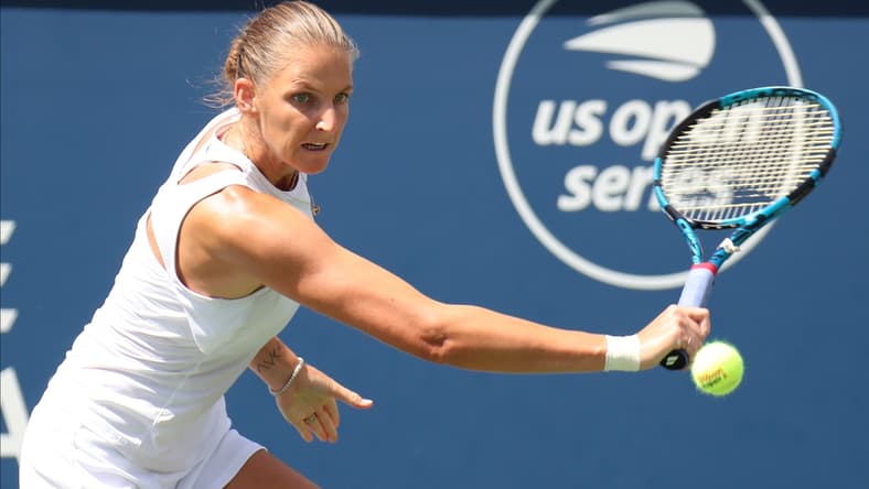 Aug 14, 2021; Montreal, Quebec, Canada; Karolina Pliskova from Czech Republic hits a shot against Aryna Sabalenka from Belarus (not pictured) during the semifinals at Stade IGA. Mandatory Credit: Jean-Yves Ahern-USA TODAY Sports