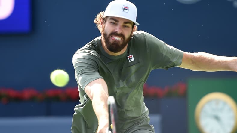 Aug 14, 2021; Toronto, Ontario, Canada;  Reilly Opelka of the United States plays a shot against Stefanos Tsiitsipas of Greece in the semi finals of the National Bank Open at Aviva Centre. Mandatory Credit: Dan Hamilton-USA TODAY Sports