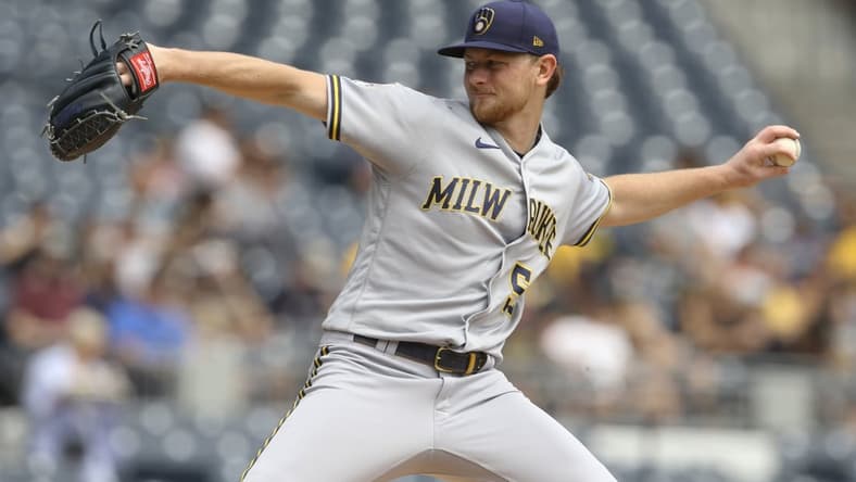Aug 15, 2021; Pittsburgh, Pennsylvania, USA; Milwaukee Brewers starting pitcher Eric Lauer (52) throws a pitch against the Pittsburgh Pirates during the first inning at PNC Park. Mandatory Credit: Charles LeClaire-USA TODAY Sports