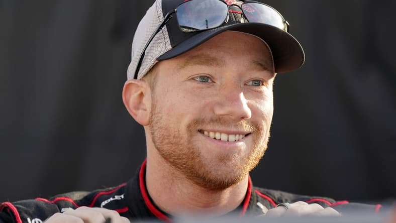 Aug 15, 2021; Speedway, Indiana, USA; NASCAR Cup Series driver Tyler Reddick (8) looks on before the Verizon 200 at the Brickyard at Indianapolis Motor Speedway Road Course. Mandatory Credit: Mike Dinovo-USA TODAY Sports