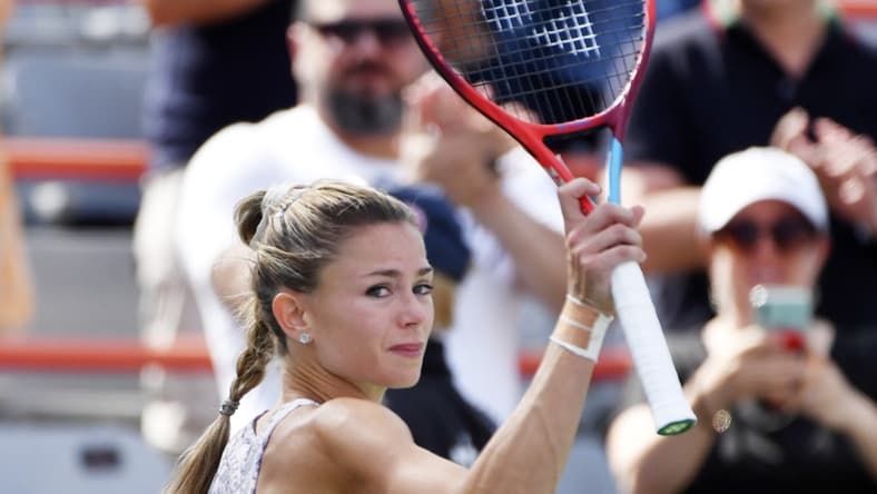 Aug 15, 2021; Montreal, Quebec, Canada; Camila Giorgi of Italy reacts after winning the match and championship point against Karolina Pliskova of the Czech Republic (not pictured) in the singles finals match during the National Bank Open at Stade IGA Mandatory Credit: Eric Bolte-USA TODAY Sports