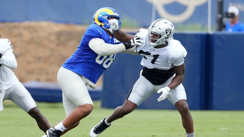 Aug 18, 2021; Thousand Oaks, CA, USA; Las Vegas Raiders defensive end Malcolm Koonce (51) is defended by Los Angeles Rams lineman A.J. Jackson aka Alaric Jackson (68) during a joint practice. Mandatory Credit: Kirby Lee-USA TODAY Sports