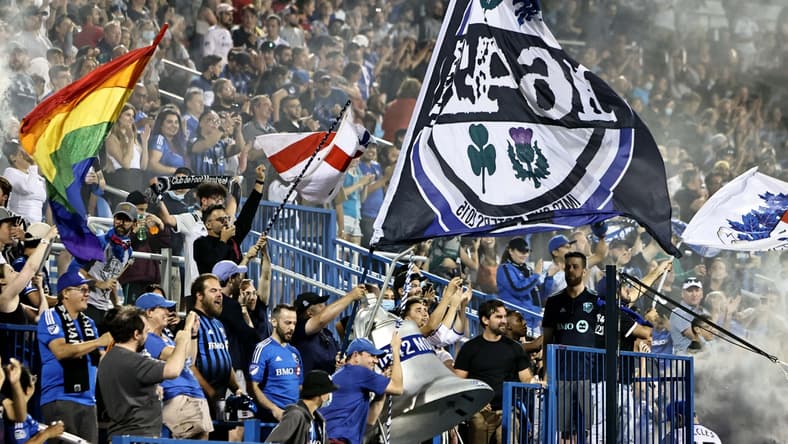 Aug 14, 2021; Montreal, Quebec, CAN; CF Montreal fans celebrate during the second half at Stade Saputo. Mandatory Credit: Jean-Yves Ahern-USA TODAY Sports