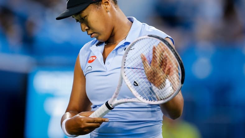 Naomi Osaka prepares to return a serve during a match between Jill Teichmann (SUI) and Naomi Osaka (JPN) in the Western & Southern Open at the Lindner Family Tennis Center in Mason, Ohio on Thursday, Aug. 19, 2021. Teichmann won 3-6, 6-3, 6-3.