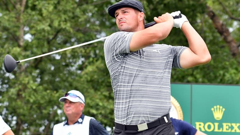 Aug 20, 2021; Jersey City, New Jersey, USA; Bryson DeChambeau watches his tee shot on the 17th hole during the second round of The Northern Trust golf tournament at the Liberty National Golf Club. Mandatory Credit: Mark Konezny-USA TODAY Sports