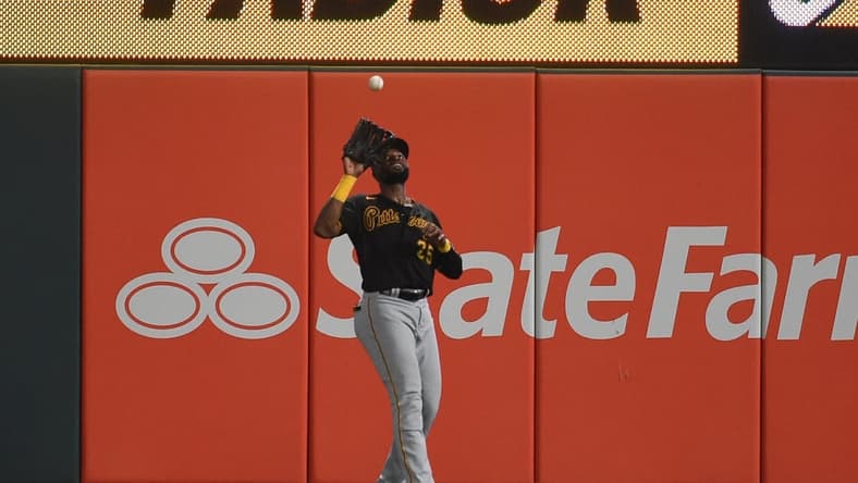 Aug 20, 2021; St. Louis, Missouri, USA; Pittsburgh Pirates right fielder Gregory Polanco (25) catches a fly ball by St. Louis Cardinals left fielder Tyler O'Neill (not pictured) during the seventh inning at Busch Stadium. Mandatory Credit: Joe Puetz-USA TODAY Sports