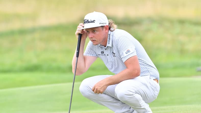 Aug 21, 2021; Jersey City, New Jersey, USA; Cameron Smith lines up his putt on the 2nd hole during the third round of The Northern Trust golf tournament at the Liberty National Golf Club. Mandatory Credit: Mark Konezny-USA TODAY Sports
