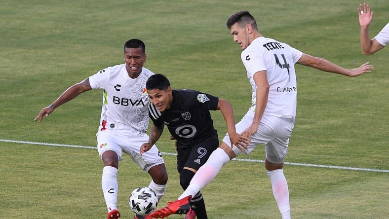 Aug 25, 2021; Los Angeles, CA, USA; Liga MX All-Stars defender Cesar Montes (4) defends against MLS All-Stars forward Raul Ruidiaz (9) in the first half during the 2021 MLS All-Star Game at Banc of California Stadium. Mandatory Credit: Orlando Ramirez-USA TODAY Sports