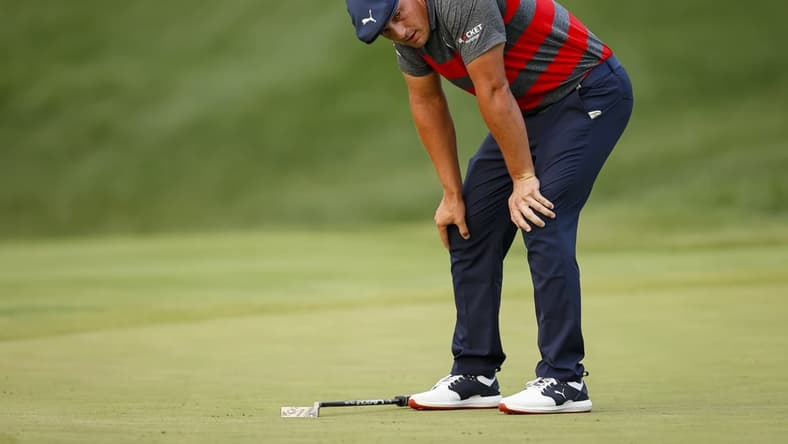 Aug 29, 2021; Owings Mills, Maryland, USA; Bryson DeChambeau reacts after missing a putt on the third playoff hole of the the final round of the BMW Championship golf tournament. Mandatory Credit: Scott Taetsch-USA TODAY Sports