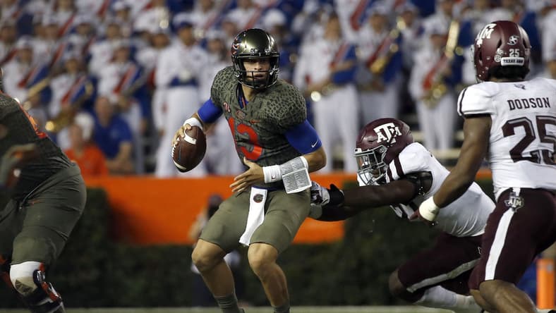 Oct 14, 2017; Gainesville, FL, USA;Florida Gators quarterback Feleipe Franks (13) runs out of the pocket as Texas A&M Aggies defensive end Michael Clemons (48) pressures during the first half at Ben Hill Griffin Stadium. Mandatory Credit: Kim Klement-USA TODAY Sports