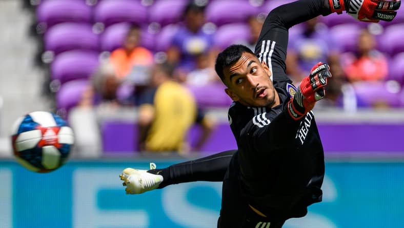 Apr 20, 2019; Orlando, FL, USA; Orlando City goalkeeper Greg Ranjitsingh (18) warms up on the field prior to the game against the Vancouver Whitecaps at Orlando City Stadium. Mandatory Credit: Douglas DeFelice-USA TODAY Sports