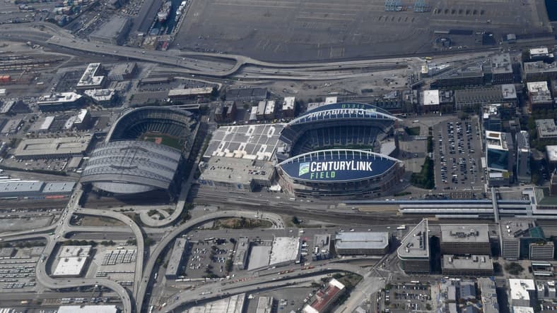 Aug 29, 2019; Seattle, WA, USA; General overall aerial view of T-Mobile Park (left) and CenturyLink Field. The retractable roof T-Mobile Park, opened in 1999 and formerly known as Safeco Field, is the home of the Seattle Mariners of the MLB. CenturyLink Field was opened in 2002 and was named Seahawks Stadium (2002-2004) and Qwest Field (2004-11). It is the home of the Seattle Seahawks of the NFL and Seattle Sounders of the MLS.Mandatory Credit: Kirby Lee-USA TODAY Sports