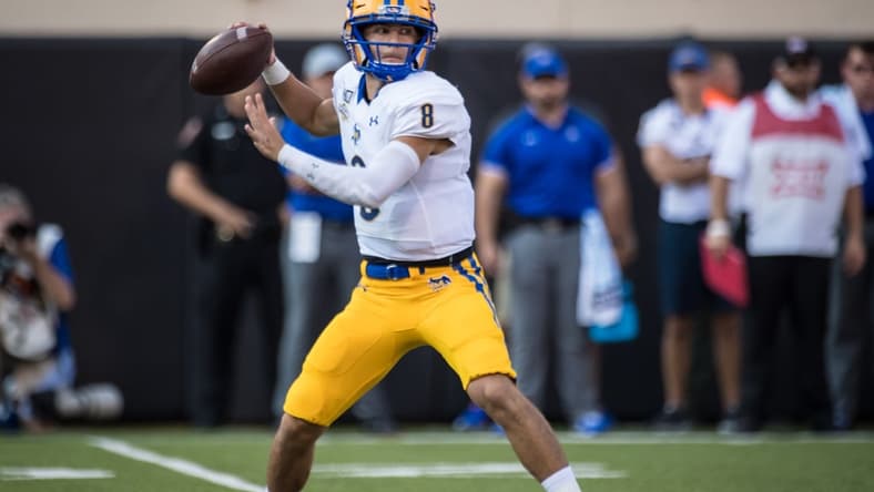 Sep 7, 2019; Stillwater, OK, USA; McNeese State Cowboys quarterback Cody Orgeron (8) drops back to pass against the Oklahoma State Cowboys during the first quarter at Boone Pickens Stadium. Mandatory Credit: Rob Ferguson-USA TODAY Sports