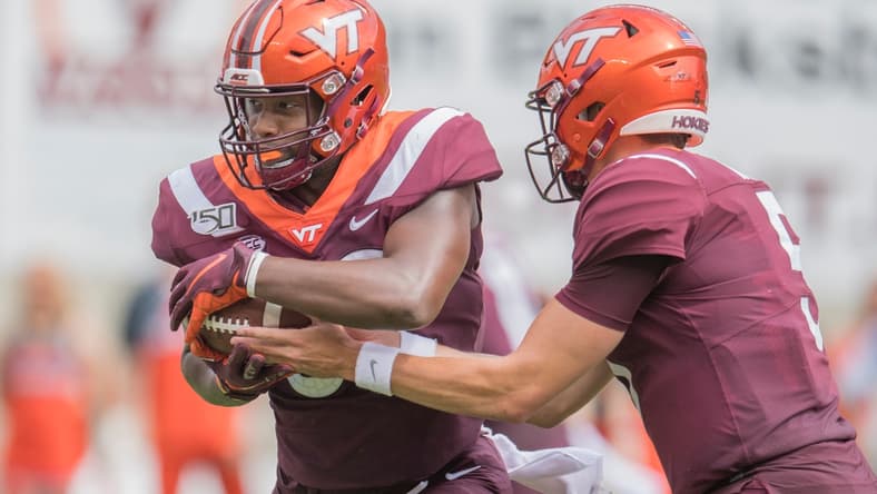 Sep 14, 2019; Blacksburg, VA, USA; Virginia Tech Hokies tight end James Mitchell (82) gets ball from quarterback Ryan Willis (5) during game against Furman Paladins at Lane Stadium. Mandatory Credit: Lee Luther Jr.-USA TODAY Sports