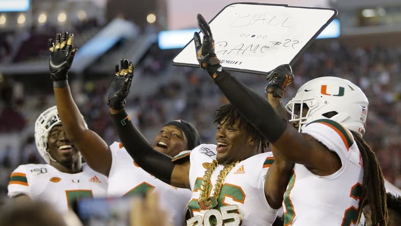 Nov 2, 2019; Tallahassee, FL, USA; Miami Hurricanes defensive back Gurvan Hall Jr. (26) celebrates after making a fourth quarter interception as the Florida State Seminoles host the Miami Hurricanes at Doak Campbell Stadium. Mandatory Credit: Glenn Beil-USA TODAY Sports