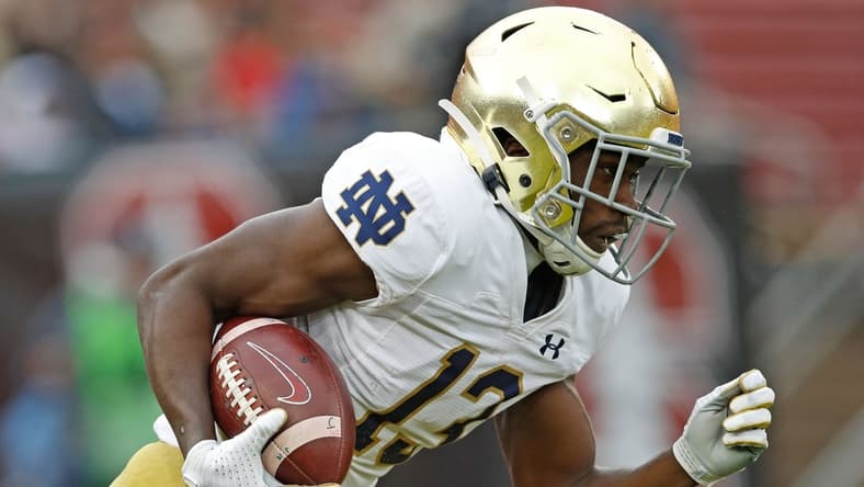 Nov 30, 2019; Stanford, CA, USA; Notre Dame Fighting Irish wide receiver Lawrence Keys III (13) returns a kickoff during the first quarter against the Stanford Cardinal at Stanford Stadium. Mandatory Credit: Darren Yamashita-USA TODAY Sports
