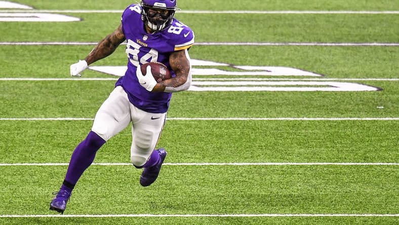 Oct 18, 2020; Minneapolis, Minnesota, USA;  Minnesota Vikings tight end Irv Smith Jr. (84) runs with the ball after a catch for a 36-yard gain in the first quarter against the Atlanta Falcons at U.S. Bank Stadium. Mandatory Credit: Nick Wosika-USA TODAY Sports