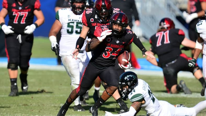 Nov 14, 2020; Carson, California, USA; San Diego State Aztecs running back Greg Bell (34) runs the ball for a touchdown against the Hawaii Warriors  during the first half at Dignity Health Sports Park. Mandatory Credit: Gary A. Vasquez-USA TODAY Sports