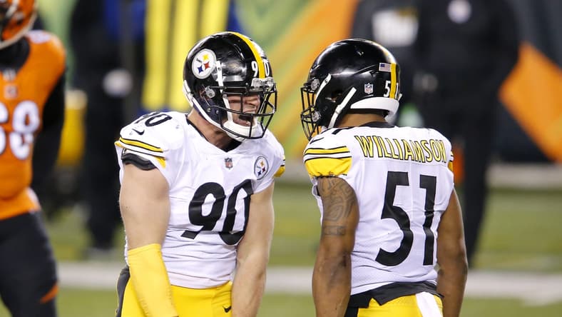 Dec 21, 2020; Cincinnati, Ohio, USA; Pittsburgh Steelers outside linebacker T.J. Watt (90) celebrates with inside linebacker Avery Williamson (51) during the third quarter at Paul Brown Stadium. Mandatory Credit: Joseph Maiorana-USA TODAY Sports
