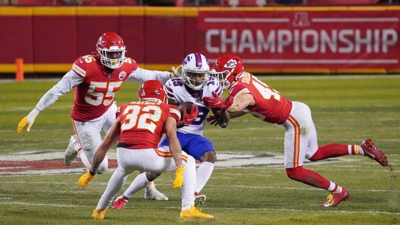 Jan 24, 2021; Kansas City, MO, USA; Buffalo Bills wide receiver Isaiah McKenzie (19) runs between Kansas City Chiefs strong safety Tyrann Mathieu (32), defensive end Frank Clark (55) and free safety Daniel Sorensen (49) during the fourth quarter in the AFC Championship Game at Arrowhead Stadium. Mandatory Credit: Denny Medley-USA TODAY Sports