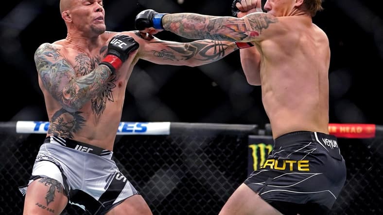 Apr 24, 2021; Jacksonville, Florida, USA; Anthony Smith (Red Gloves) fights Jimmy Crute (Blue Gloves) during UFC 261 at VyStar Veterans Memorial Arena. Mandatory Credit: Jasen Vinlove-USA TODAY Sports
