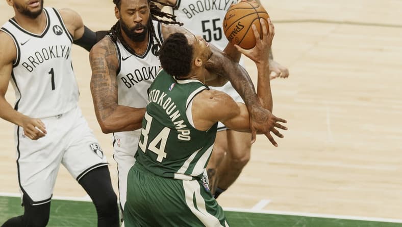 May 2, 2021; Milwaukee, Wisconsin, USA; Brooklyn Nets center DeAndre Jordan (6) fouls Milwaukee Bucks forward Giannis Antetokounmpo (34) during the second quarter at Fiserv Forum. Mandatory Credit: Jeff Hanisch-USA TODAY Sports