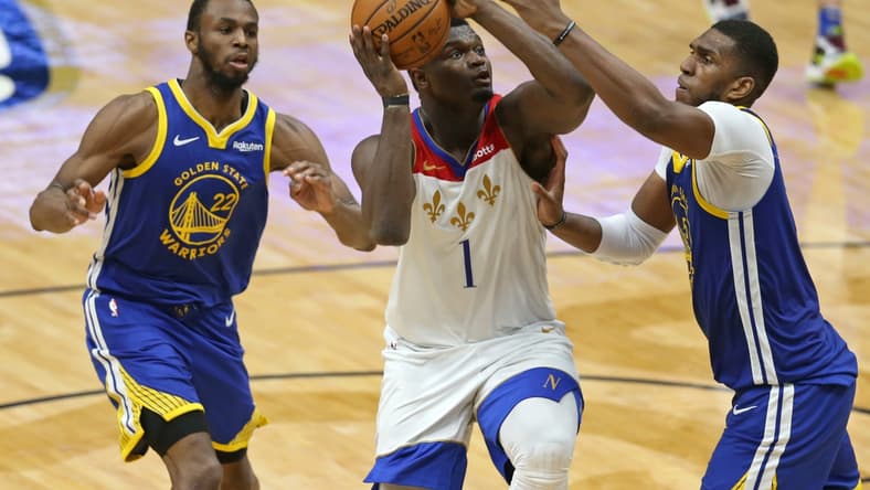 May 4, 2021; New Orleans, Louisiana, USA; New Orleans Pelicans forward Zion Williamson (1) drives on Golden State Warriors forward Kevon Looney (5) in the third quarter at the Smoothie King Center. Mandatory Credit: Chuck Cook-USA TODAY Sports